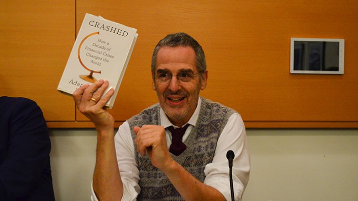 Professor Mark Mazower holds up a copy of Crashed