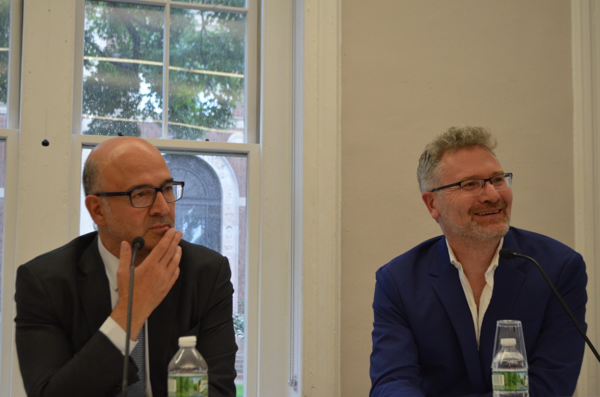 Pierre Moscovici and Adam Tooze listen to a question from the audience