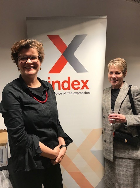Sally Gimson and Victoria Phillips stand beside a banner for "Index: the voice of free expression"