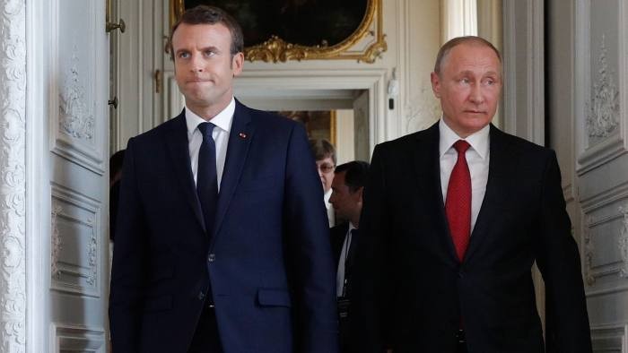Emmanuel Macron, left, with Vladimir Putin at Versailles in 2017