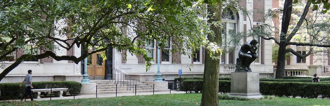 Columbia University campus - Greenery in the foreground and Rodin's Thinker statue and Columbia buildings in the background