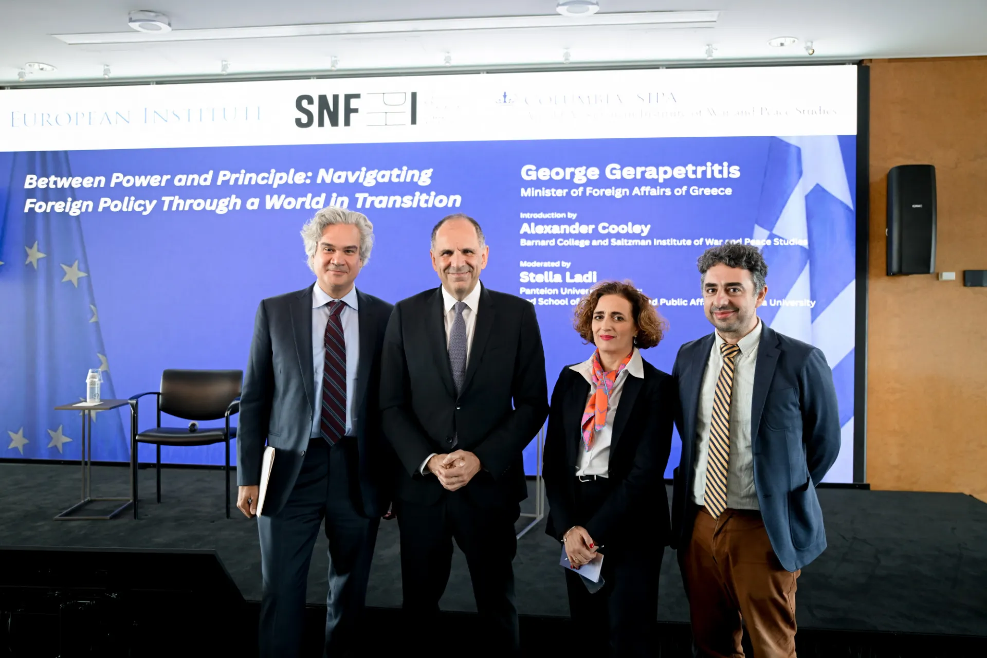 George Gerapetritis, Alexander Cooley, and Stella Ladi smile for a photo.